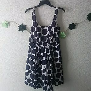 A blue and white polka dot dress